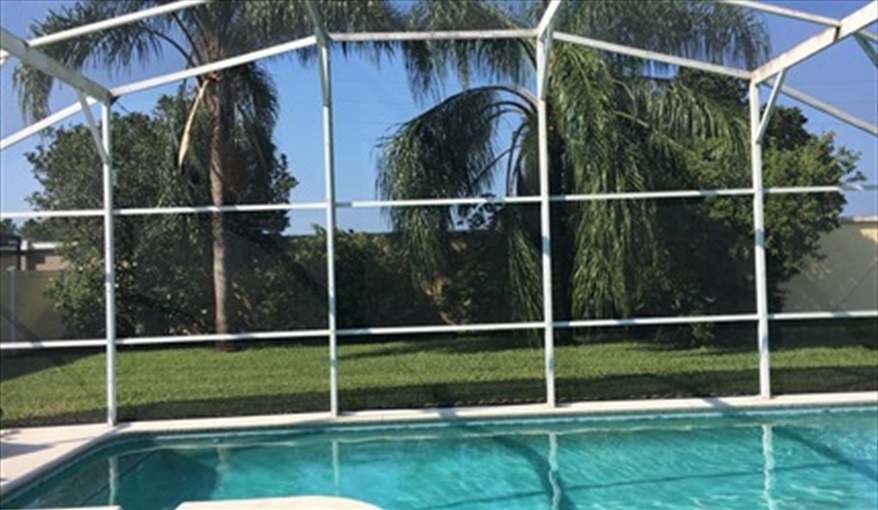 Across the pool and into the garden. Villa Verna in Indian Creek, Kissimmee, Orlando