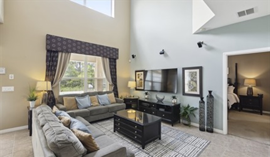 Family Area with 65 inch Smart TV. Watersong Villa Florida. 6 Bedrooms 5.5 Bathrooms with 4 en-suite. Conservation Views. Pool & Spa.  in Watersong, Davenport, Orlando