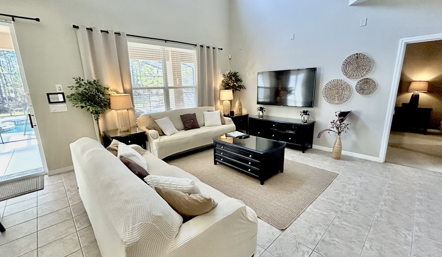 Family  Room. Watersong Villa Florida. 6 Bedrooms 5.5 Bathrooms with 4 en-suite. Conservation Views. Pool & Spa.  in Watersong, Davenport, Orlando