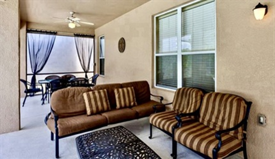 Outdoor Seating Area . Watersong Villa Florida. 6 Bedrooms 5.5 Bathrooms with 4 en-suite. Conservation Views. Pool & Spa.  in Watersong, Davenport, Orlando