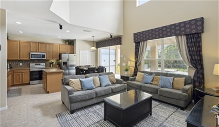Family Area and Kitchen. Watersong Villa Florida. 6 Bedrooms 5.5 Bathrooms with 4 en-suite. Conservation Views. Pool & Spa.  in Watersong, Davenport, Orlando