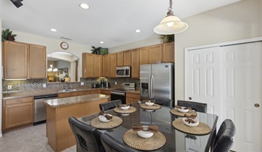 Kitchen and Dining area. Watersong Villa Florida. 6 Bedrooms 5.5 Bathrooms with 4 en-suite. Conservation Views. Pool & Spa.  in Watersong, Davenport, Orlando