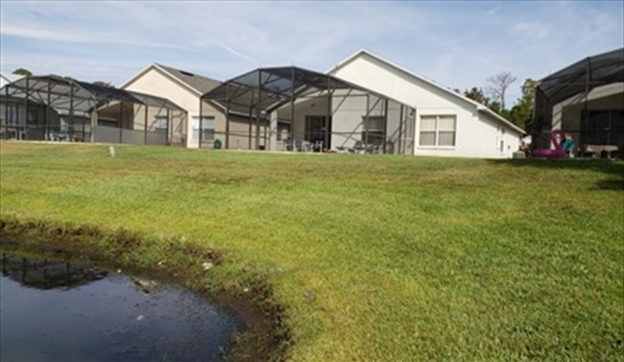 Back of House from Lake. Lakeside Lodge at Eagle Pointe in Eagle Pointe, Kissimmee, Orlando