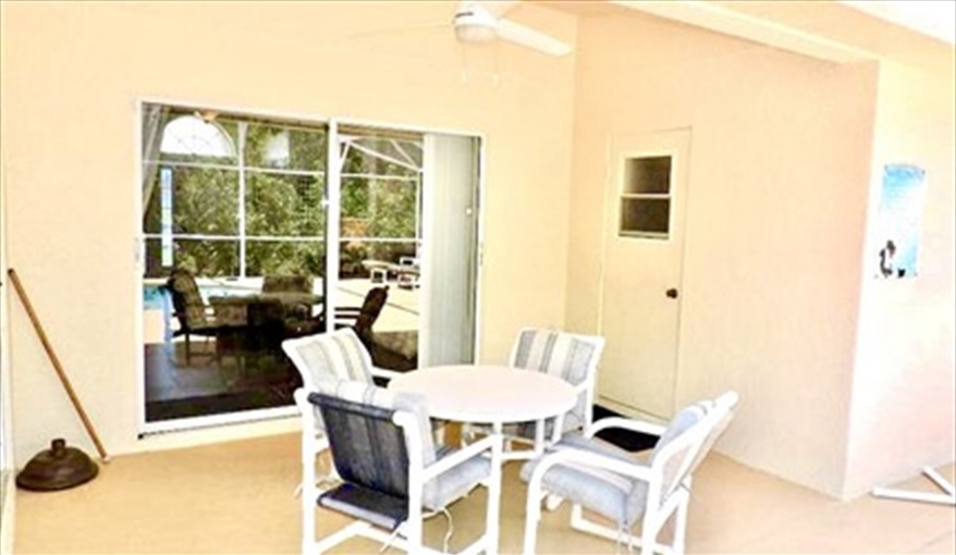Covered lanai provides shade for your outside dining. Ref 80.Stunning Villa with private pool. Near Disney, Eagle Point in Eagle Pointe, Kissimmee, Orlando