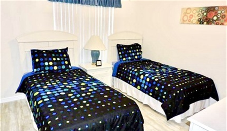 Bedroom 3: Twin beds with cable TV and an adjacent bathroom with shower over tub. Ref 80.Stunning Villa with private pool. Near Disney, Eagle Point in Eagle Pointe, Kissimmee, Orlando
