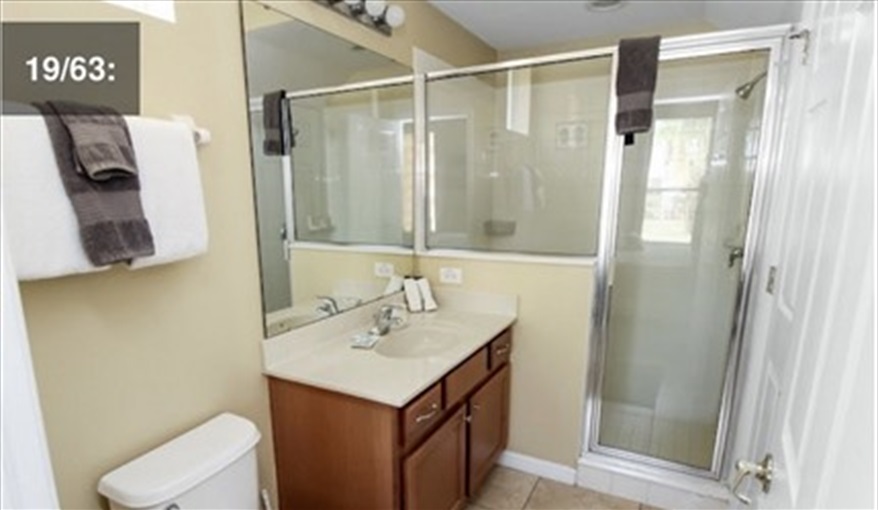 Bathroom with open shower. Ref 701BV. Villa at Bella Vida with own South facing pool., Games room & near to Disney in Bellavida Resort, Kissimmee, Orlando