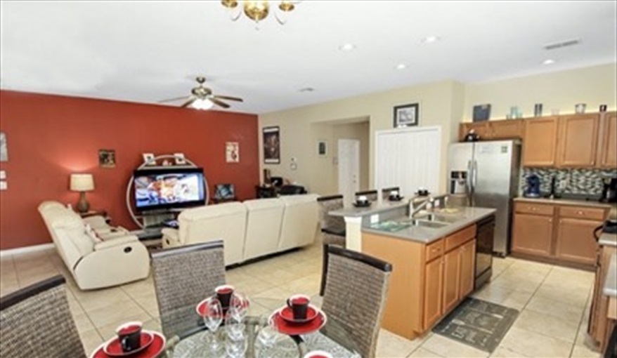 Full view of the living area and kitchen . Ref 701BV. Villa at Bella Vida with own South facing pool., Games room & near to Disney in Bellavida Resort, Kissimmee, Orlando