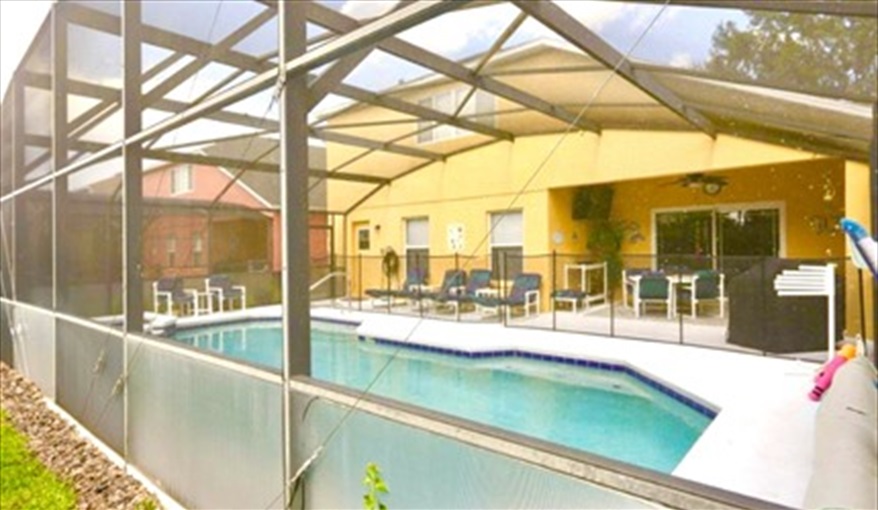 Plenty of seating around the pool and a child safety fence is available. Ref 114. Modern family villa own pool, near Disney. Silver Creek in Silver Creek, Clermont, Orlando