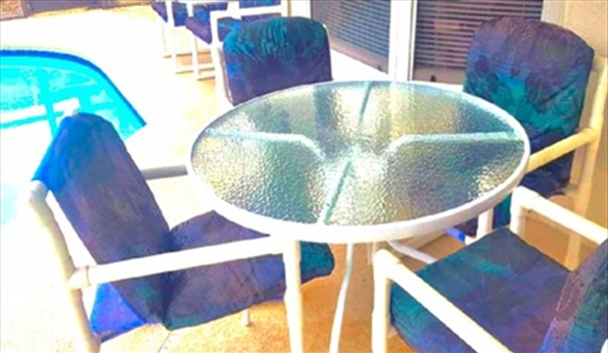 Table and chairs for al fresco dining. Ref 993PF. Family home, free BBQ. Near Disney. Pet friendly in Lindfields, Kissimmee, Orlando