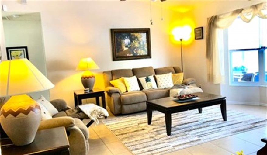 Spacious living area with plenty of comfortable seating. Ref 993PF. Family home, free BBQ. Near Disney. Pet friendly in Lindfields, Kissimmee, Orlando