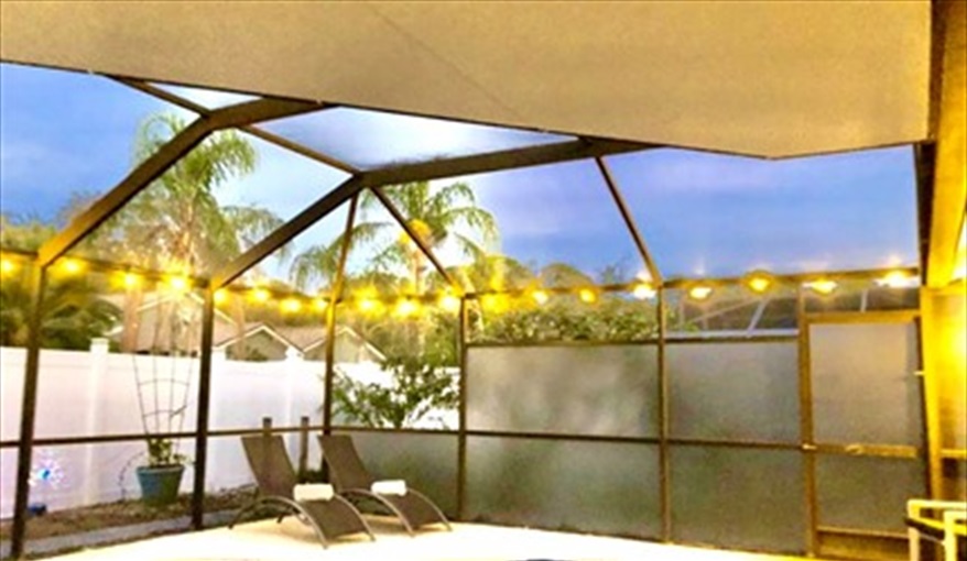 Enjoy a BBQ around the pool as the sun sets. Ref 993PF. Family home, free BBQ. Near Disney. Pet friendly in Lindfields, Kissimmee, Orlando