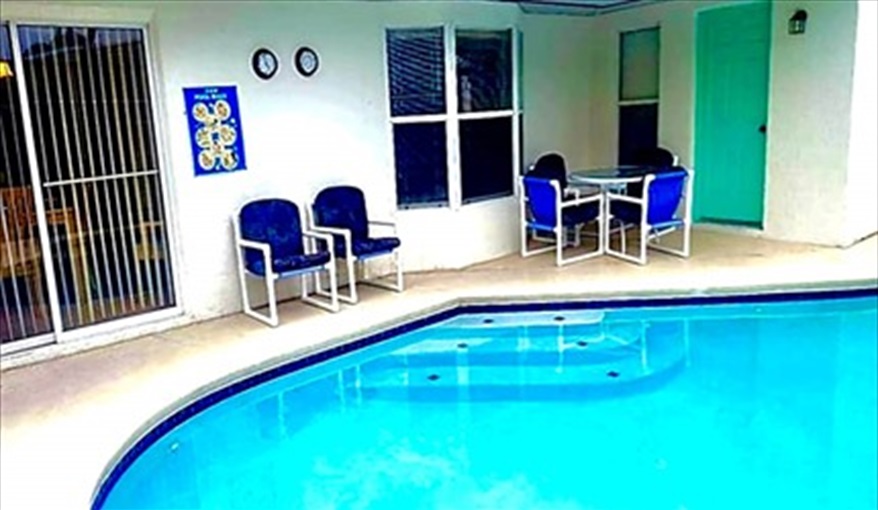 Plenty of pool side furniture; a space to enjoy the Florida sunshine. Ref 993PF. Family home, free BBQ. Near Disney. Pet friendly in Lindfields, Kissimmee, Orlando