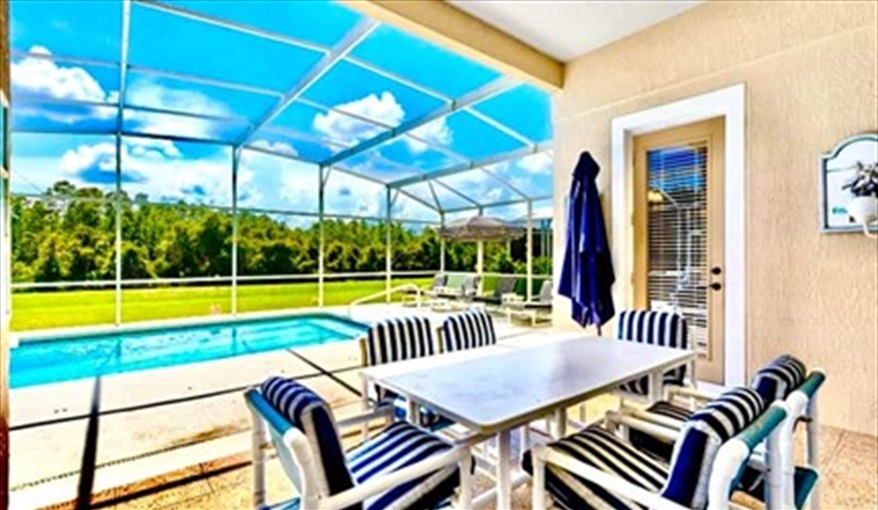 Al fresco dining by your pool. Ref 89. Stunning Villa on Highlands Reserve golf course in Highlands Reserve, Davenport, Orlando