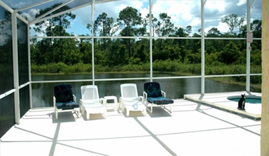 Pool deck and lake view. SOUTH PALMS in Bridgewater Crossing, Davenport, Orlando