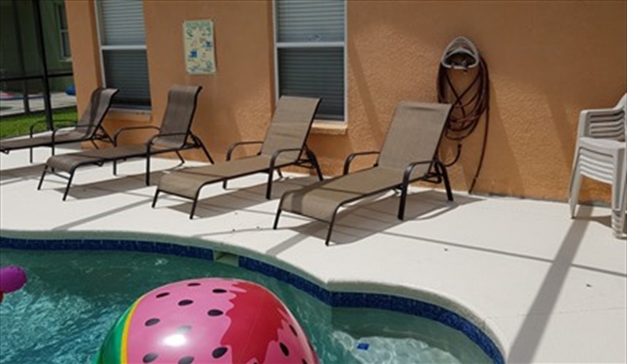 Lots of loungers and chairs for all. Pluto's Palace Florida Villa in Sandy Ridge, Davenport, Orlando