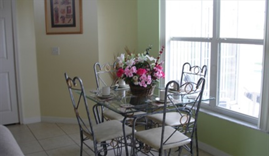 Breakfast Nook Overlooking Pool and Lake. Lakeside Villa in Crescent Lakes, Kissimmee, Orlando
