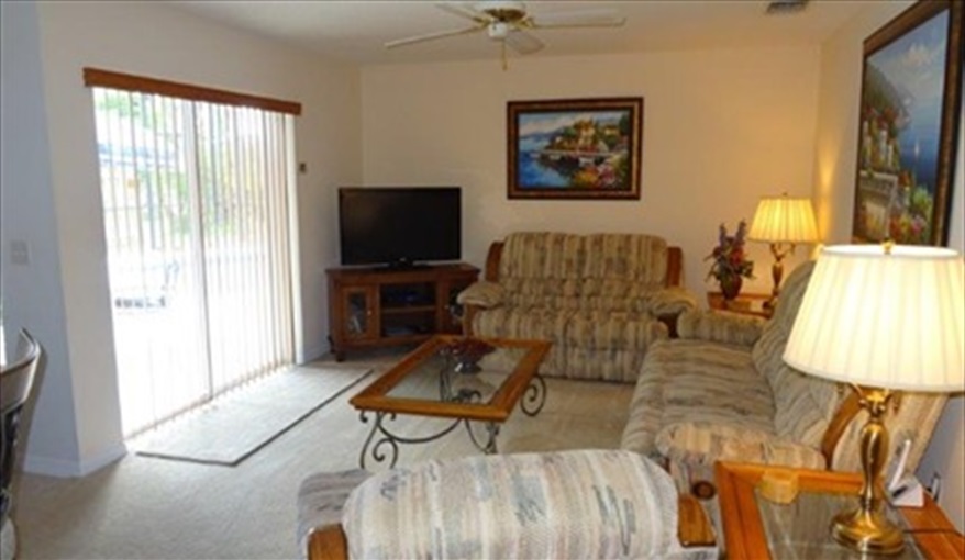 TV Room with view to Pool Area. Deer Creek Villa Close To SeaWorld in Deer Creek Village, Orlando, Orlando