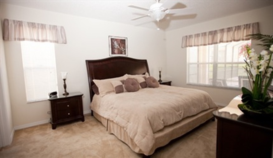 King-size master suite located on the ground floor. Leila's Sunrise - 7 Bedroom Deluxe Villa with Pool in Emerald Island Resort, Kissimmee, Orlando