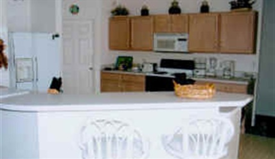The kitchen area with its food bar. The Palms in Sunridge Woods, Davenport, Orlando