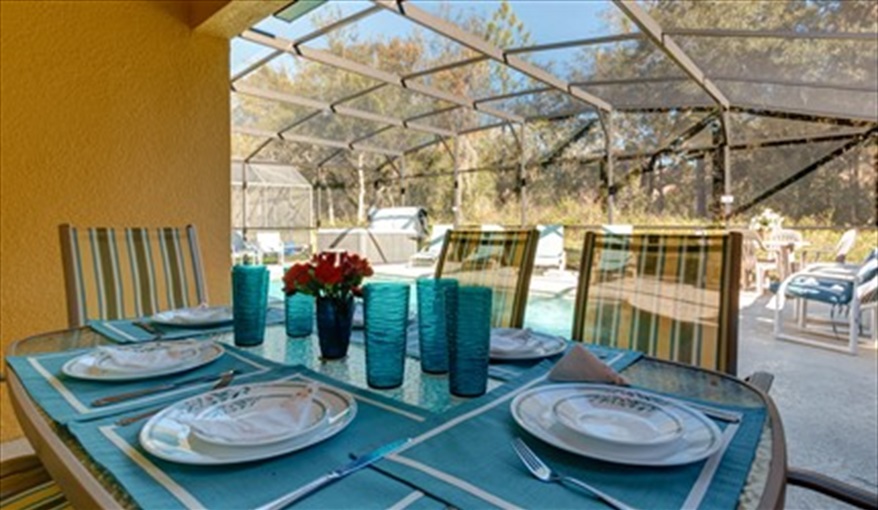 Skc villa pool deck and lanai dining. Secret Key Cove Villa in Emerald Island Resort, Kissimmee, Orlando