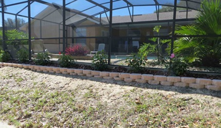 Landscaping around the pool. Luxury villa, 3 Bedrooms, 2 Baths with stunning pool and games room in Indian Ridge, Kissimmee, Orlando