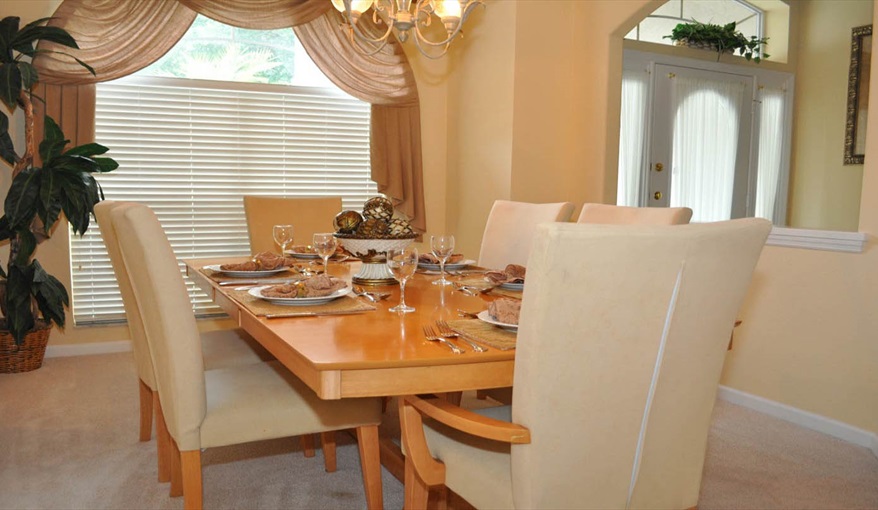 Formal sic place dining room. Only You Florida Villa. Highlands Reserve Golf Community former showhome with HUGE master suite and gamesroom in Highlands Reserve, Davenport, Orlando