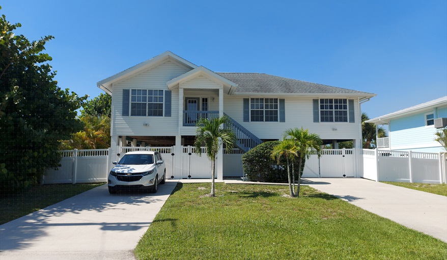 Villa on a QUIET, no-through road. Lots of parking: under villa or on the 2 drives. Island Villa with 33 Foot Infinity Pool, Dock, Dolphin Visits in Fort Myers Beach, Fort Myers, Gulf Coast
