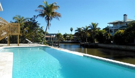 The 33 foot infinity pool with massage jets and underwater lighting for night-time dips.. Island Villa with 33 Foot Infinity Pool, Dock, Dolphin Visits in Fort Myers Beach, Fort Myers, Gulf Coast