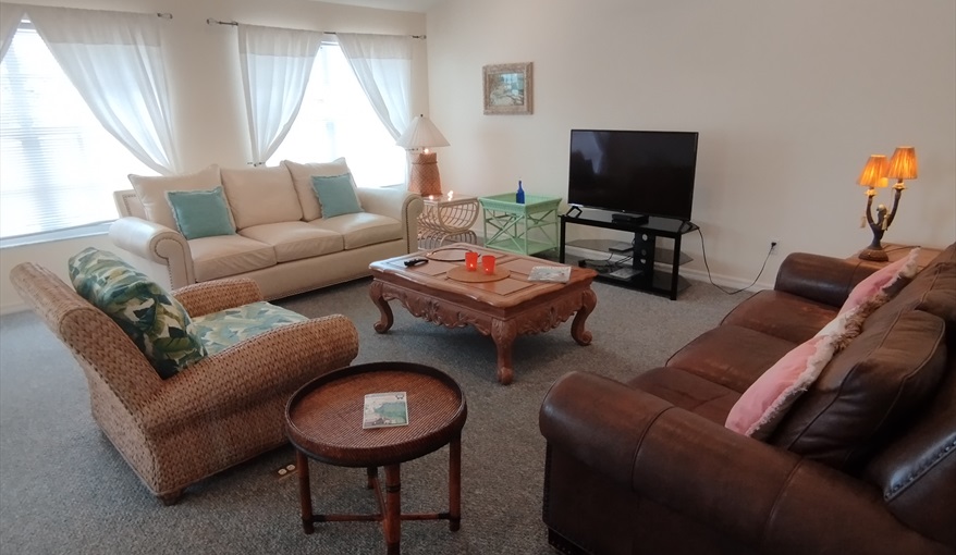 Lounge area, facing pool and canal.. Island Villa with 33 Foot Infinity Pool, Dock, Dolphin Visits in Fort Myers Beach, Fort Myers, Gulf Coast