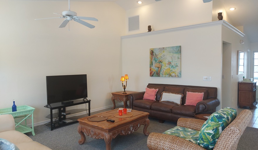 Lounge area, vaulted ceiling, facing hall and front door.. Island Villa with 33 Foot Infinity Pool, Dock, Dolphin Visits in Fort Myers Beach, Fort Myers, Gulf Coast